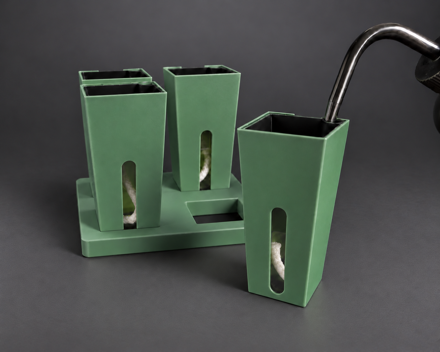 Forest Green small self-watering cups with one cup removed from the base