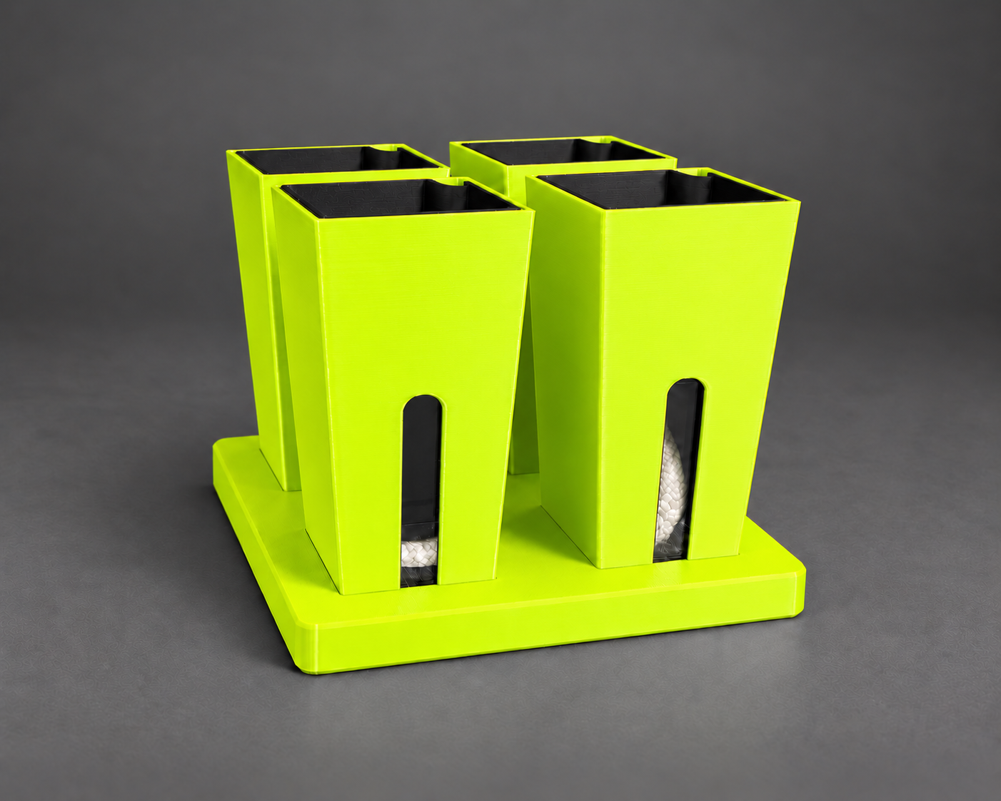 Four neon green small self-watering cups in their matching base